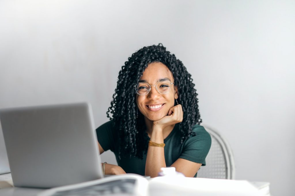 Girl Smiling with Computer
